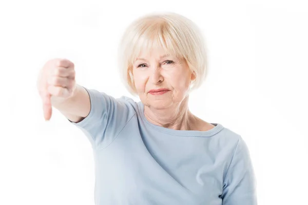 Senior woman with thumb down gesture isolated on white — Stock Photo