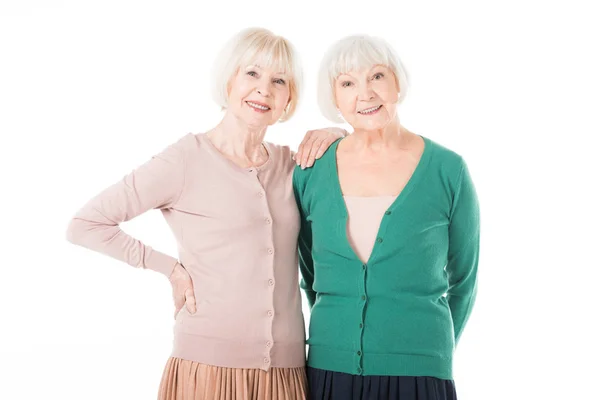 Two stylish senior women standing isolated on white — Stock Photo