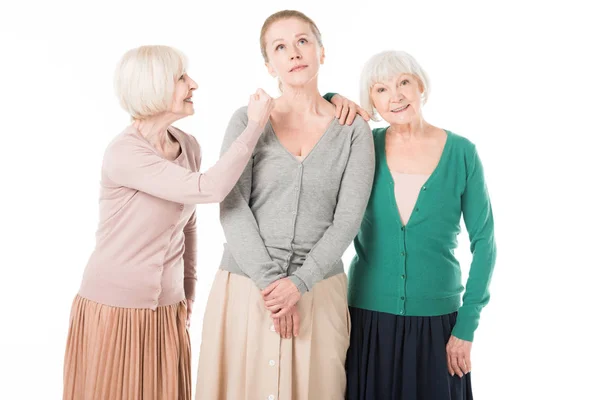 Três mulheres elegantes em saias e cardigans isolados em branco — Fotografia de Stock