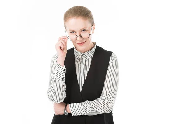 Stylish mature businesswoman looking over eyeglasses isolated on white — Stock Photo