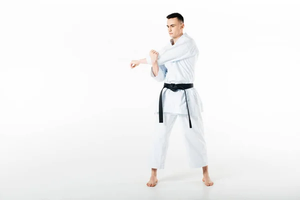 Maschio karate combattente stretching mani isolato su bianco — Foto stock