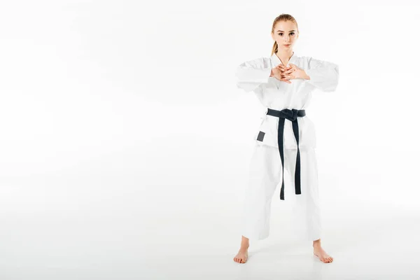 Luchador de karate femenino estirando los dedos aislados en blanco - foto de stock