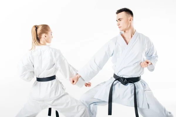 Combatientes de karate bloque de entrenamiento aislado en blanco — Stock Photo