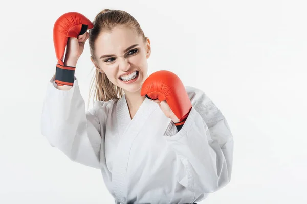 Female karate fighter training with gloves and mouthguard isolated on white — Stock Photo