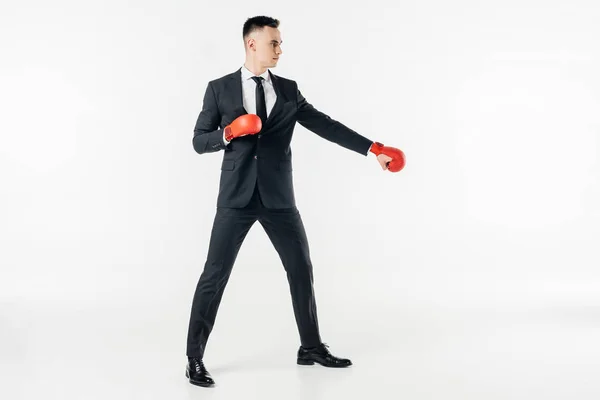 Hombre de negocios con traje y guantes rojos aislados en blanco — Stock Photo