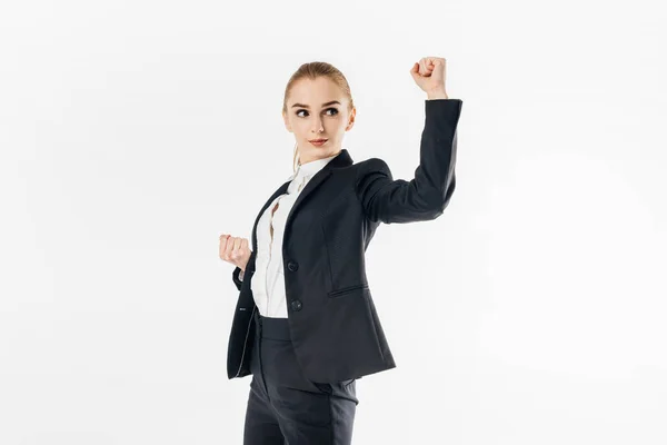 Businesswoman standing in karate position in suit isolated on white — Stock Photo