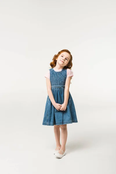 Stylish little child in dress standing isolated on white — Stock Photo