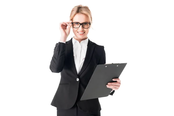 Smiling businesswoman holding clipboard isolated on white — Stock Photo