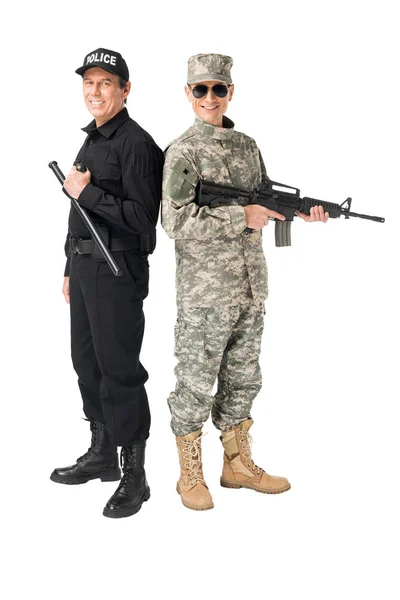 Young soldier with gun and policeman with baton isolated on white — Stock Photo