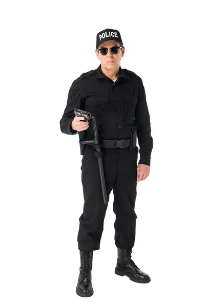 Serious policeman in sunglasses holding gun isolated on white — Stock Photo