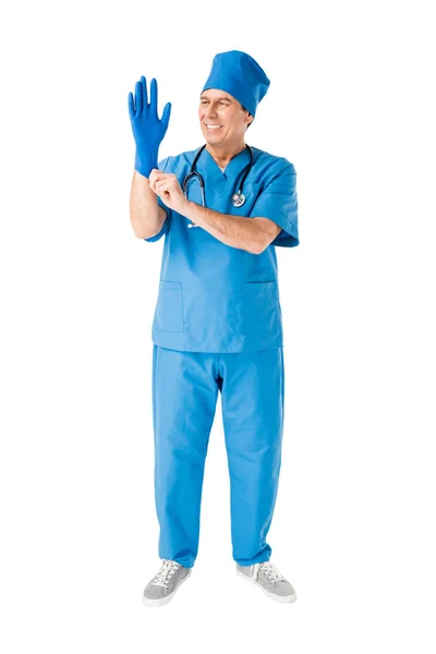 Smiling male doctor wearing medical glove isolated on white — Stock Photo