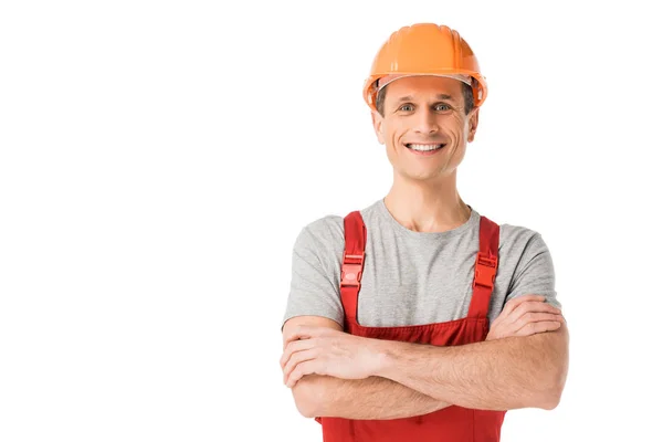 Homme à tout faire souriant en salopette avec les bras croisés isolés sur blanc — Photo de stock