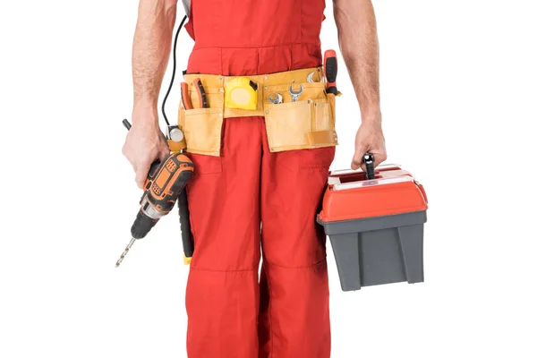 Close-up view of handyman holding toolbox and drill isolated on white — Stock Photo