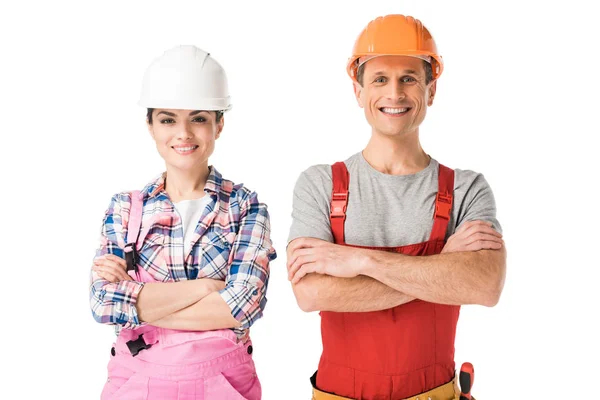 Constructores profesionales sonrientes hombre y mujer aislados en blanco - foto de stock