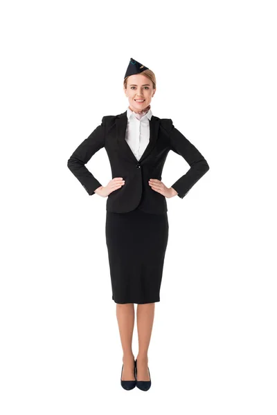 Smiling young stewardess in uniform isolated on white — Stock Photo