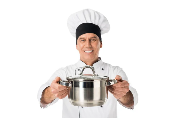 Chef in uniform and toque blanche holding pan isolated on white — Stock Photo