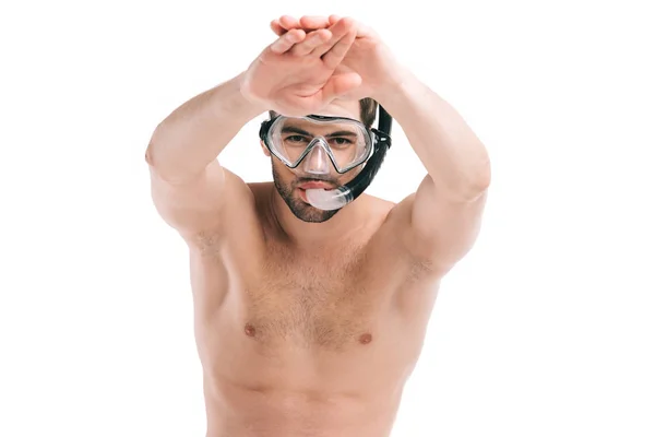 Handsome shirtless young man in diving mask swimming and looking at camera isolated on white — Stock Photo