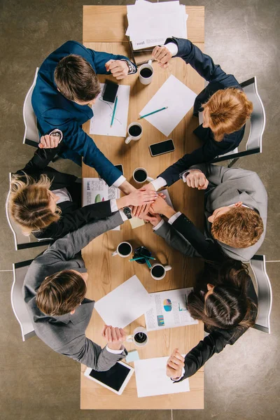 Top view of colleagues at table in office, businesspeople teamwork collaboration relation concept — Stock Photo