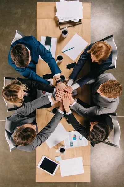 Overhead view of business partners at table in office, businesspeople teamwork collaboration relation concept — Stock Photo