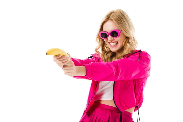 Muchacha joven con disparos de color rosa de plátano aislado en blanco - foto de stock