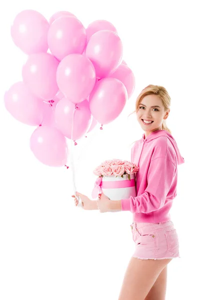 Blonde Frau in pinkfarbener Kleidung mit Luftballons mit Blumen auf weißem Grund — Stockfoto