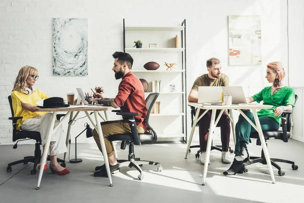 Group of young creative workers working on project in office — Stock Photo