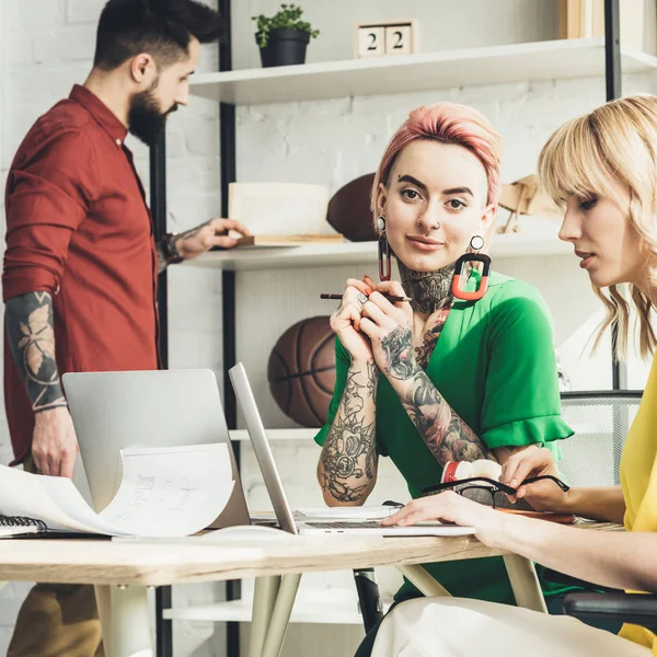 Selective focus of group of young creative workers in office — Stock Photo