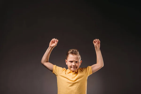 Preteen angry boy gesturing, isolated on grey — Stock Photo