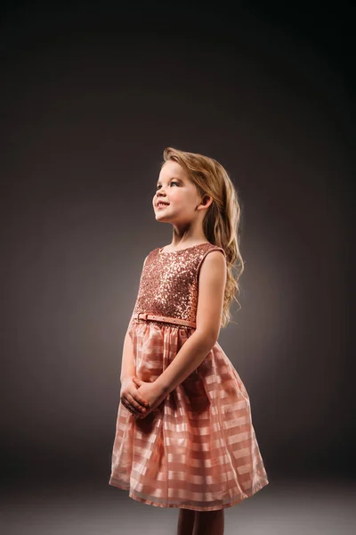 Adorable princess in pink dress, isolated on grey — Stock Photo