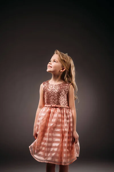 Adorable kid in pink princess dress, isolated on grey — Stock Photo