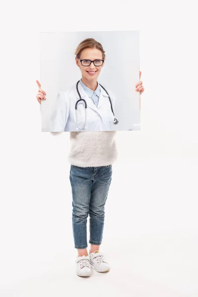 Little kid pretending to be professional doctor, isolated on white — Stock Photo