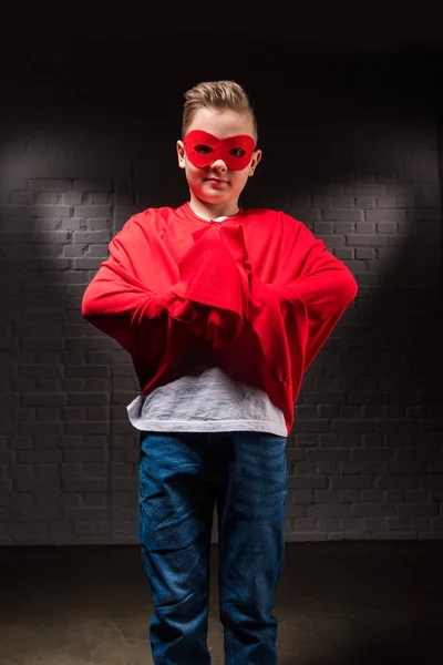 Little superman in red mask and cloak — Stock Photo