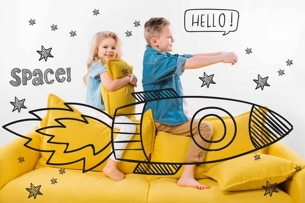 Brother and sister riding drawn rocket in space while sitting on sofa at home — Stock Photo