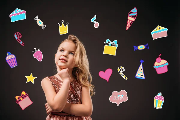 Adorable thoughtful child in pink dress, isolated on grey with birthday icons — Stock Photo