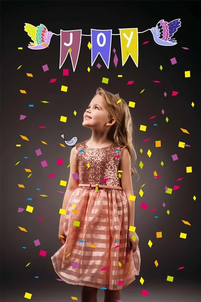 Adorable kid in pink princess dress, isolated on grey with confetti and joy symbol illustration — Stock Photo