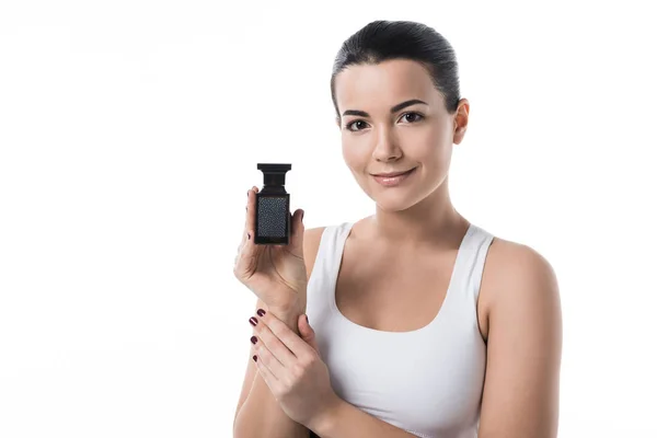 Menina bonita segurando creme hidratante e olhando para a câmera isolada no branco — Fotografia de Stock