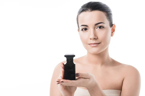 Beautiful girl holding jar of moisturizing cream and looking at camera isolated on white — Stock Photo