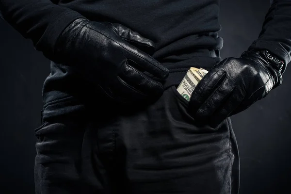 Close-up view of dollar banknotes in pocket of thief — Stock Photo