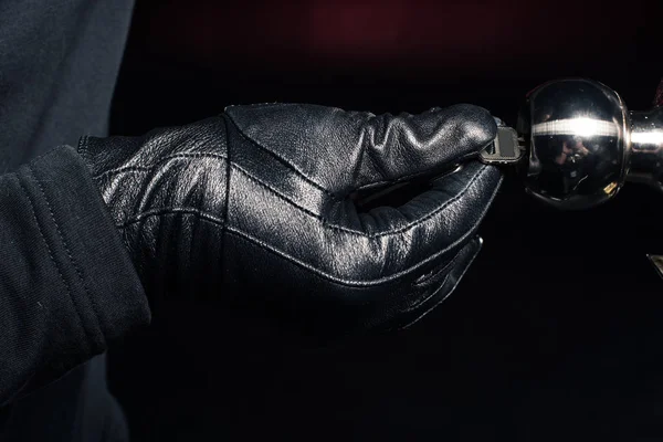 Close-up view of male hand opening lock with key — Stock Photo