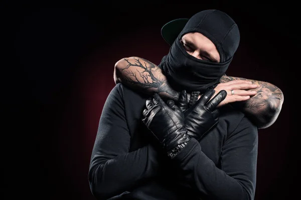 Man chocking burglar dressed in black clothes and balaclava — Stock Photo