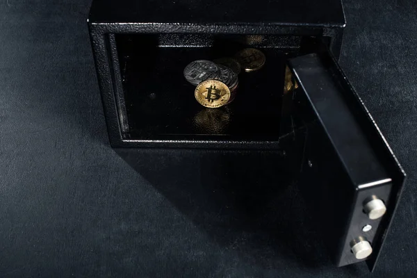 Bitcoin cryptocurrency stacked in open strongbox — Stock Photo