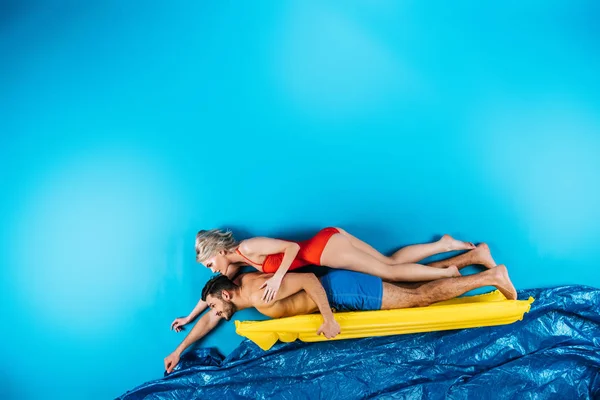 Couple on inflatable mattress — Stock Photo
