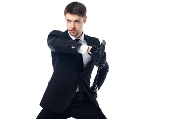 Confident agent in suit and gloves with katana isolated on white — Stock Photo