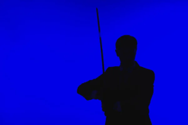 Toned picture of silhouette of agent in suit with Katana — Stock Photo