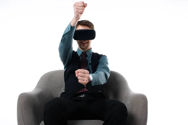 Portrait of agent in virtual reality headset sitting in armchair isolated on white — Stock Photo