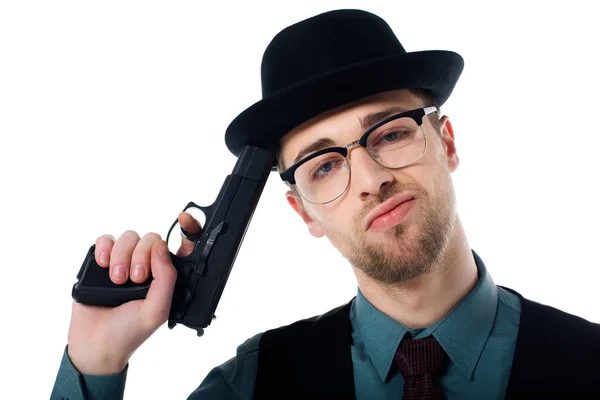 Portrait of spy agent in hat and eyeglasses with gun isolated on white — Stock Photo