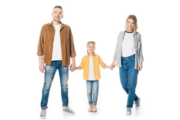 Família sorrindo de mãos dadas e olhando para a câmera isolada no branco — Fotografia de Stock