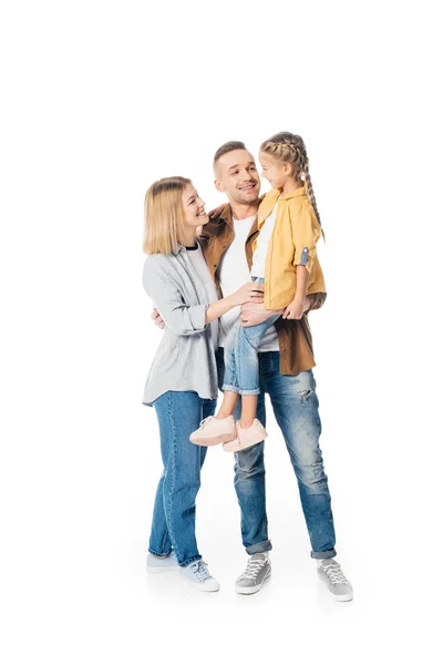 Smiling man holding cute daughter with wife standing near by isolated on white — Stock Photo