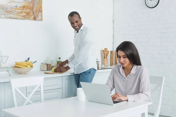 Girlfriend using laptop — Stock Photo