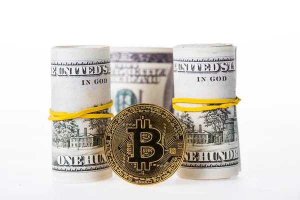 Close-up view of rolled dollar banknotes and bitcoin isolated on white — Stock Photo